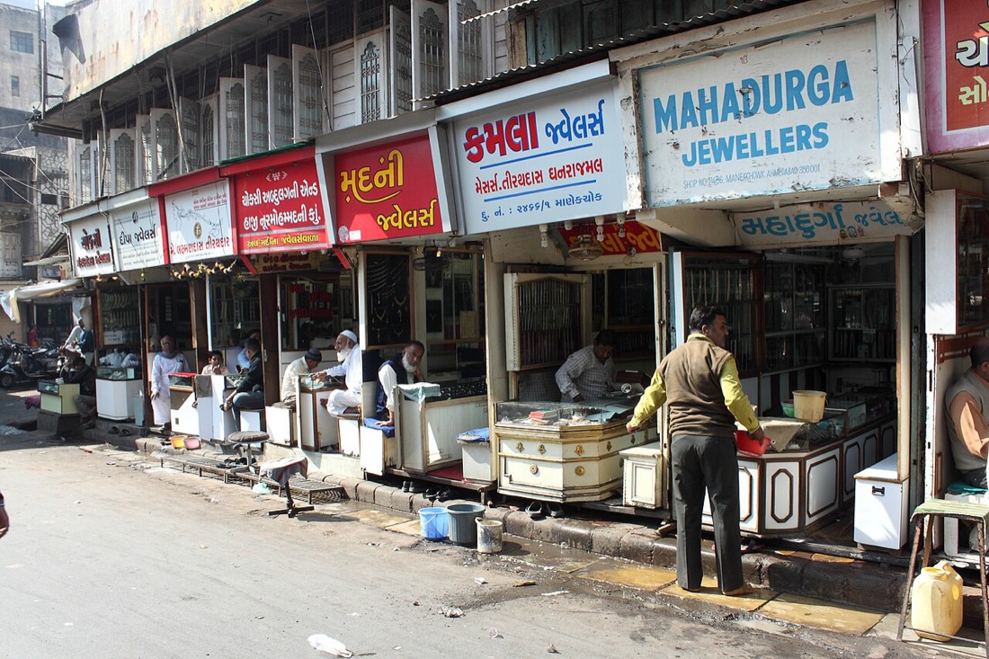 Jewellery shops in Manek Chowk, Ahmedabad, where Indian buyers pay the daily 22 karat gold rate plus making charges and 3% GST
