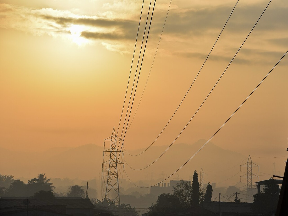 High-voltage transmission lines at sunrise in Maharashtra, the grid capacity AI data centres now compete for