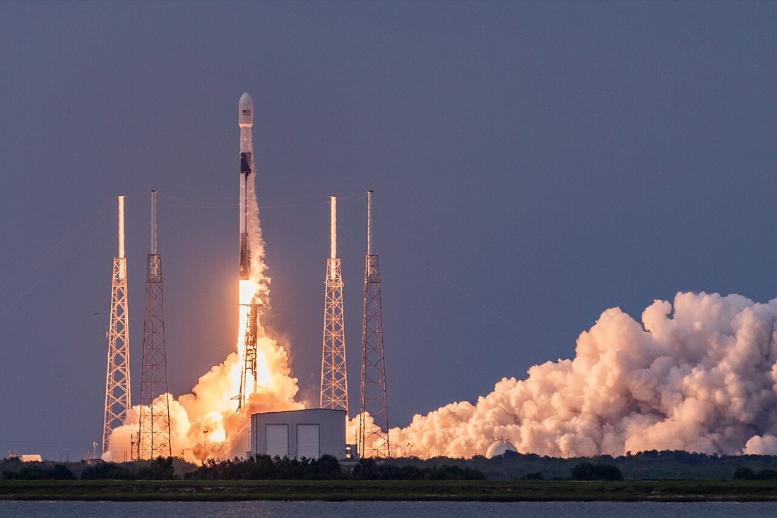 A SpaceX Falcon 9 rocket lifting off from Cape Canaveral
